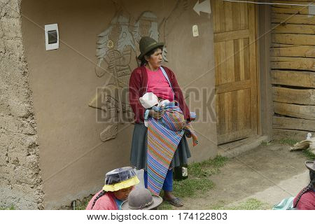 Native peruvian woman and her baby, Paru Paru Community, Andes Mountain. October 22 2012 - Paru Paru Peru