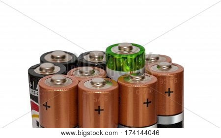Many batteries in different colors, top view.