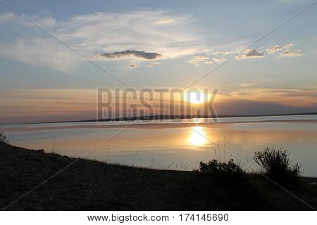 the setting sun reflected in the pond, lake, water, transparent