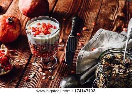 Homemade Dessert with Ingredients on Wooden Table. Series on Prepare Healthy Dessert with Pomegranate Granola Cream and Jam