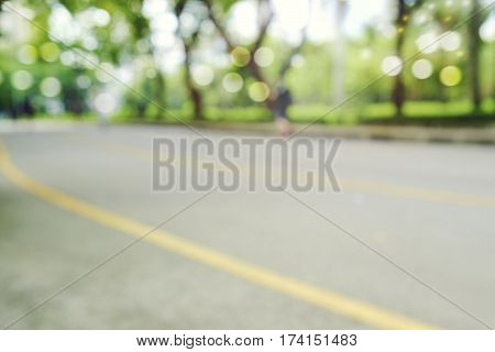 defocused bokeh background of garden trees in sunny day