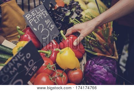 People Buying Vegetable From Shop at Market