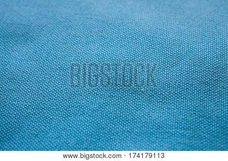 Blue fabric texture. Blue cloth background. Close up view of blue fabric texture and background. Abstract background and texture for designers.