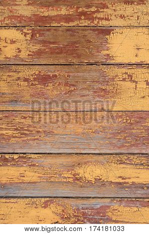 Old shabby wooden wall painted faded brown vertical