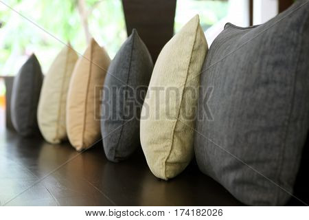 Line of pillows. Focus on the second cushion