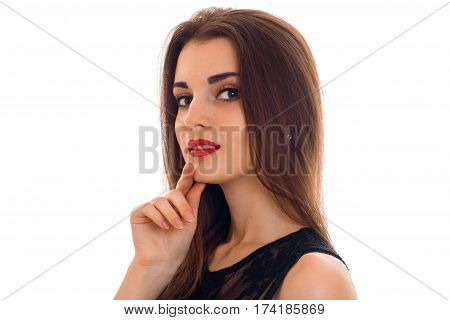 Portrait of an attractive young girl with red lipstick that looks into the camera close-up isolated on white background