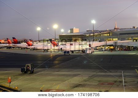 BOSTON - SEP. 26, 2015: Airplanes of Delta Air Lines at Boston Logan International Airport at sunrise, Boston, Massachusetts, USA.