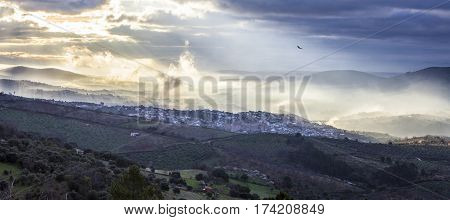 Stunning overview of Guadalupe village during a foggy sunrise Caceres Spain. Panoramic view