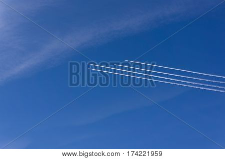 planes over Europe. blue sky. 4 aircraft in the same direction.