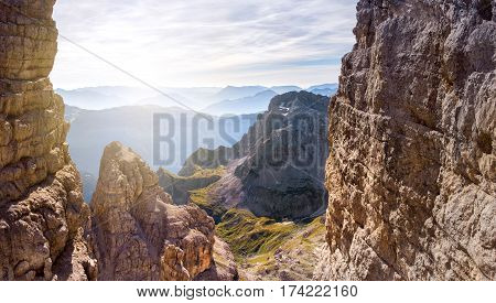 via ferrata, sunny morning in the mountains. Dolomites, green valley