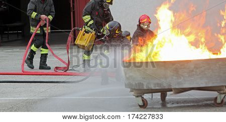 Fire Fighters During The Exercise In The Firehouse To Extinguish