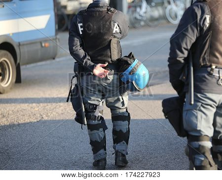 Italian Police In Riot Gear With Flak Jackets And Blue Helmets A