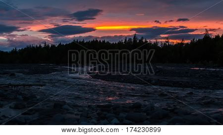 Beautiful sunset on the river Studenaya. Kamchatka Peninsula.