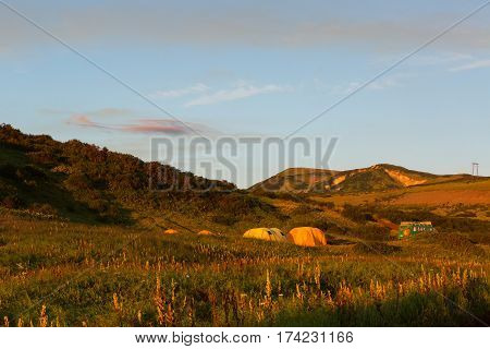 Campground in the brookvalley Spokoyny at the foot of outer north-eastern slope of caldera volcano Gorely.