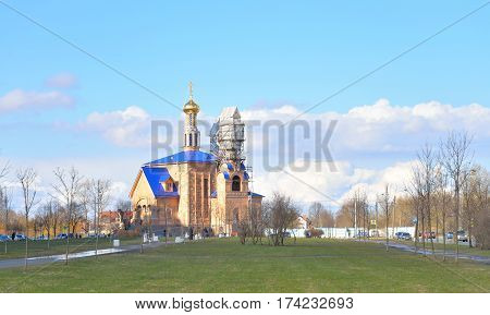 Park in Rybatskoe and The Church at early spring in St.Petersburg Russia.