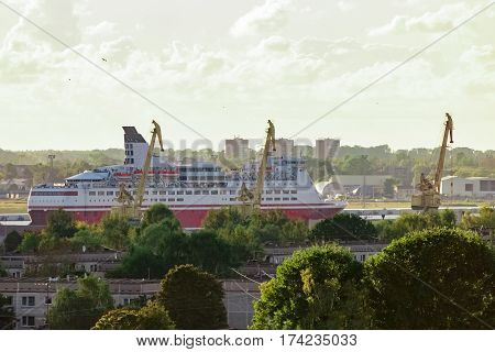 Red cruise ship. Passenger ferry sailing around the Riga city