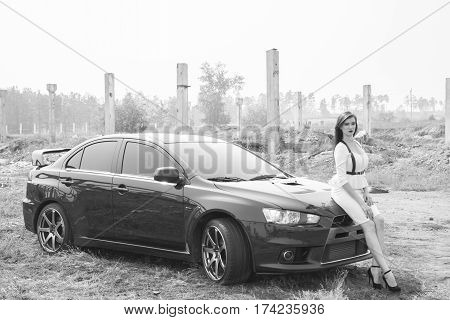 Beautiful Girl Detective Near The Sports Car.