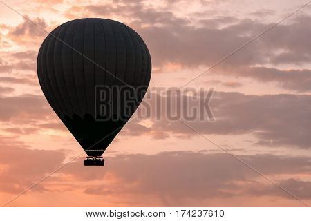 Balloon silhouette in the sunrise sky. Cappadocia, Turkey