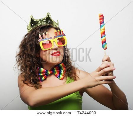 Young woman having fun. Young pretty woman with crown is laughin