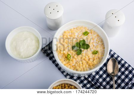 Dahi Bundi or Boondi Raita, favourite indian started or side dish made using Rajasthani snack food made from sweetened, fried chickpea flour, called Boondi with sweet and salty curd or buttermilk