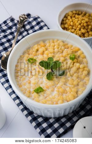 Dahi Bundi or Boondi Raita, favourite indian started or side dish made using Rajasthani snack food made from sweetened, fried chickpea flour, called Boondi with sweet and salty curd or buttermilk