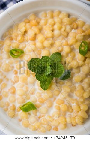 Dahi Bundi or Boondi Raita, favourite indian started or side dish made using Rajasthani snack food made from sweetened, fried chickpea flour, called Boondi with sweet and salty curd or buttermilk
