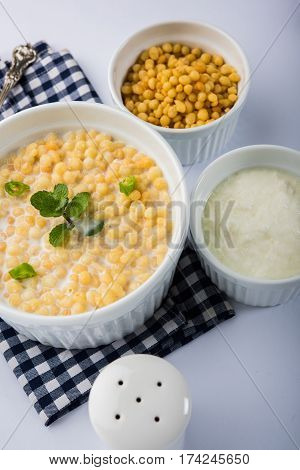 Dahi Bundi or Boondi Raita, favourite indian started or side dish made using Rajasthani snack food made from sweetened, fried chickpea flour, called Boondi with sweet and salty curd or buttermilk