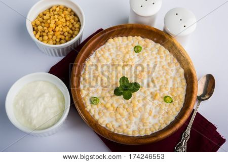 Dahi Bundi or Boondi Raita, favourite indian started or side dish made using Rajasthani snack food made from sweetened, fried chickpea flour, called Boondi with sweet and salty curd or buttermilk