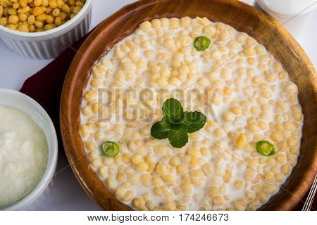 Dahi Bundi or Boondi Raita, favourite indian started or side dish made using Rajasthani snack food made from sweetened, fried chickpea flour, called Boondi with sweet and salty curd or buttermilk