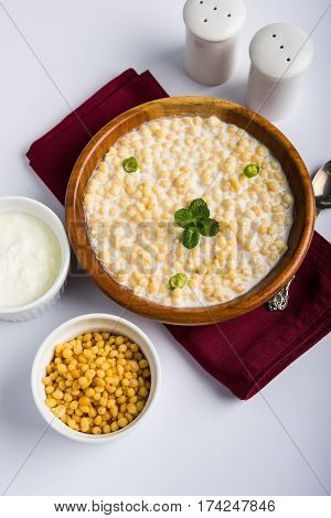 Dahi Bundi or Boondi Raita, favourite indian started or side dish made using Rajasthani snack food made from sweetened, fried chickpea flour, called Boondi with sweet and salty curd or buttermilk