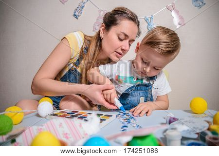 mother with kid paint and drawing have time togather