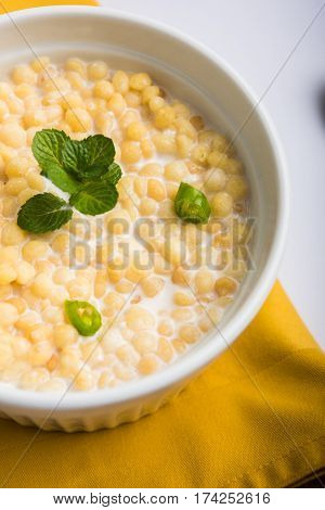 Dahi Bundi or Boondi Raita, favourite indian started or side dish made using Rajasthani snack food made from sweetened, fried chickpea flour, called Boondi with sweet and salty curd or buttermilk