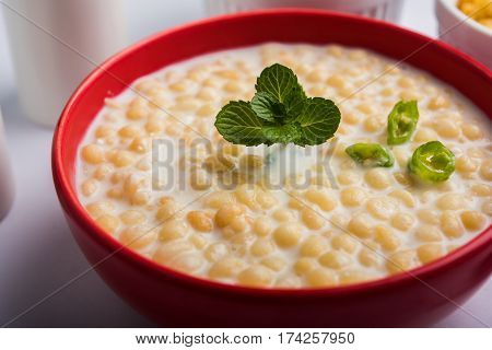 Dahi Bundi or Boondi Raita, favourite indian started or side dish made using Rajasthani snack food made from sweetened, fried chickpea flour, called Boondi with sweet and salty curd or buttermilk