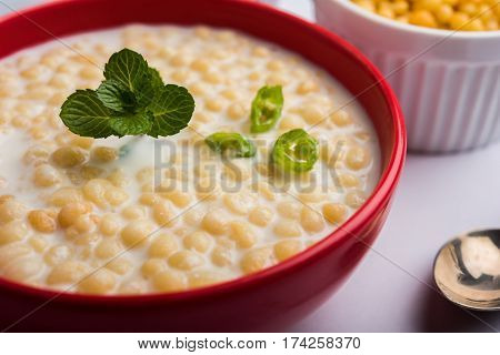 Dahi Bundi or Boondi Raita, favourite indian started or side dish made using Rajasthani snack food made from sweetened, fried chickpea flour, called Boondi with sweet and salty curd or buttermilk