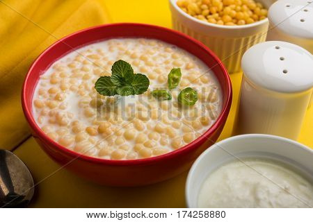 Dahi Bundi or Boondi Raita, favourite indian started or side dish made using Rajasthani snack food made from sweetened, fried chickpea flour, called Boondi with sweet and salty curd or buttermilk