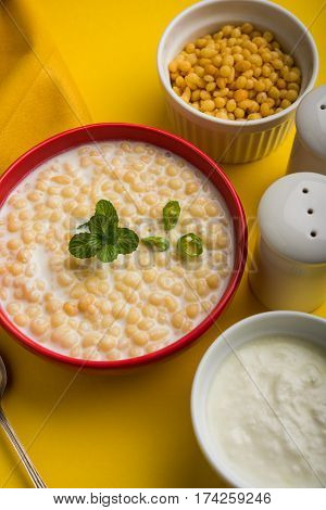 Dahi Bundi or Boondi Raita, favourite indian started or side dish made using Rajasthani snack food made from sweetened, fried chickpea flour, called Boondi with sweet and salty curd or buttermilk