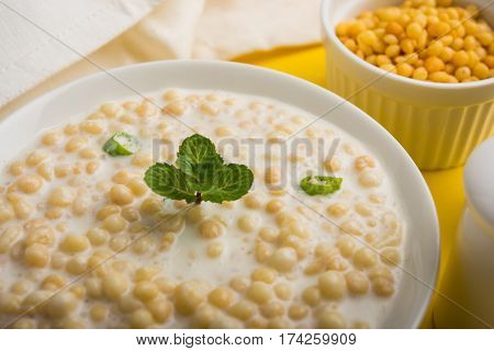 Dahi Bundi or Boondi Raita, favourite indian started or side dish made using Rajasthani snack food made from sweetened, fried chickpea flour, called Boondi with sweet and salty curd or buttermilk