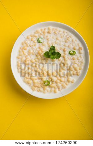 Dahi Bundi or Boondi Raita, favourite indian started or side dish made using Rajasthani snack food made from sweetened, fried chickpea flour, called Boondi with sweet and salty curd or buttermilk