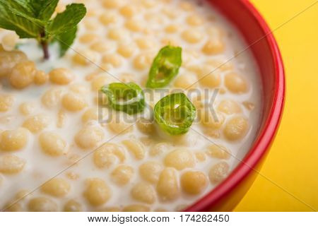 Dahi Bundi or Boondi Raita, favourite indian started or side dish made using Rajasthani snack food made from sweetened, fried chickpea flour, called Boondi with sweet and salty curd or buttermilk
