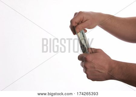 Close-up Of Person Hand Giving US dollar banknote money. Сoncept of salary.