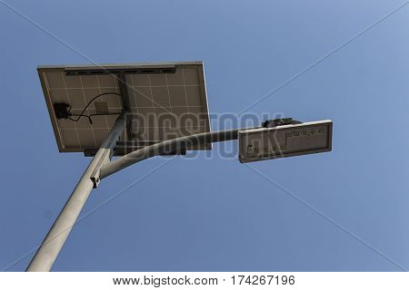 solar pannel and LED street lamp pole on blue sky