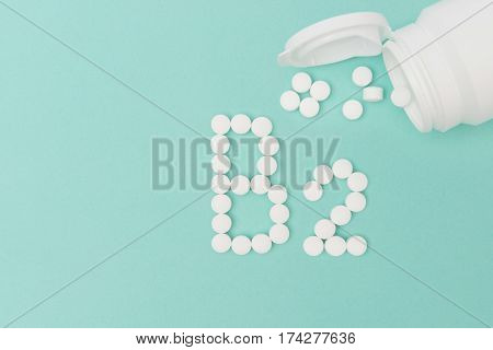 Bottle With Vitamin B2 Pills Forming The Word 'b2'
