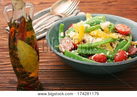 Snow pea salad with feta, tomato and pepper. Low fat healthy eating concept.