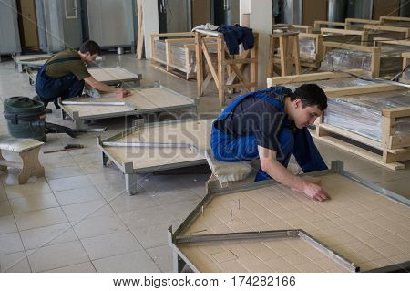 Workers Assemble Shower Cabins Ship