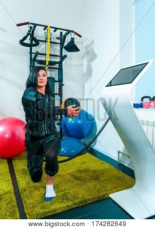 The female athlete doing they exercise in the EMS fitness studio