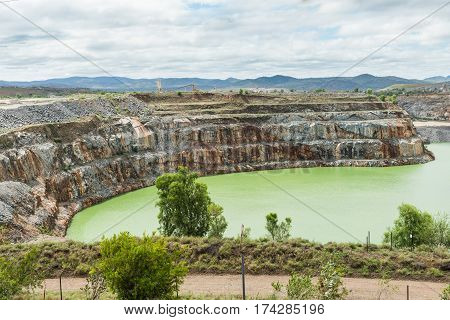 Open cut gold mine pit no longer used and full of water