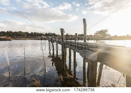 Wooden pontoon on Auzance river in Brem-sur-mer, France