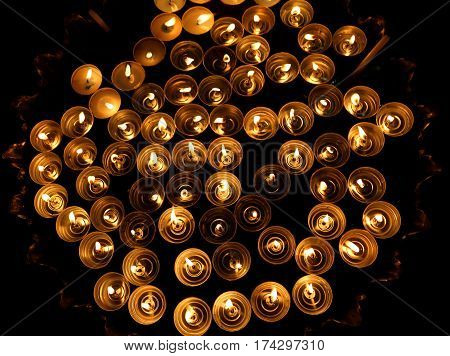 Many Candles Lit With The Warm Flame During The Religious Rite