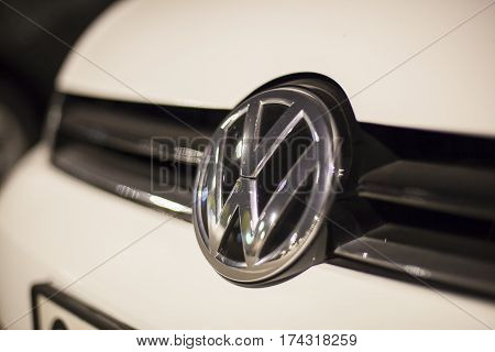 ABU DHABI UAE - NOV 26 2016: Volkswagen company logo on a car illuminated at night