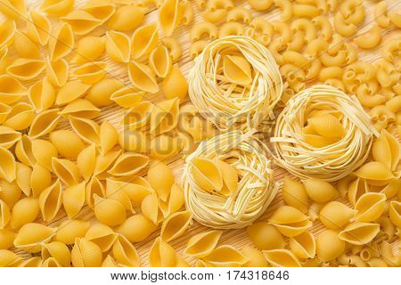 Tagliatelle Pasta. Uncooked raw macaroni Abstract background